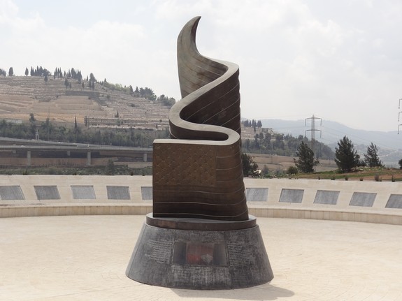 The 9/11 Memorial at the entrance to Jerusalem presents an American flag rising victoriously from the flames of the collapsing Twin Towers. This was the first 9/11 Memorial outside the United States to contain the names of all the nearly 3,000 victims. A piece of the Word Trade Center is embedded at the bottom of the memorial.