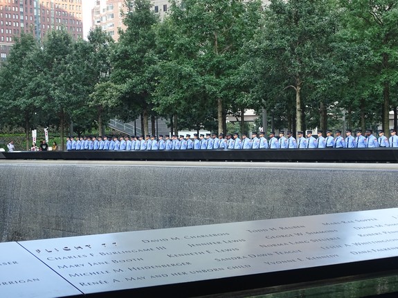 FDNY cadets line up along the sides of the 9/11 Memorial bearing the names of the First Responders who died on 9/11.